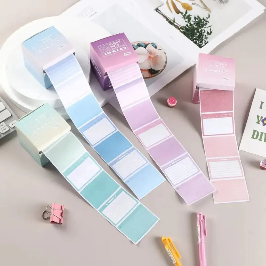 Pastel-colored sticky notes with packaging on a light surface