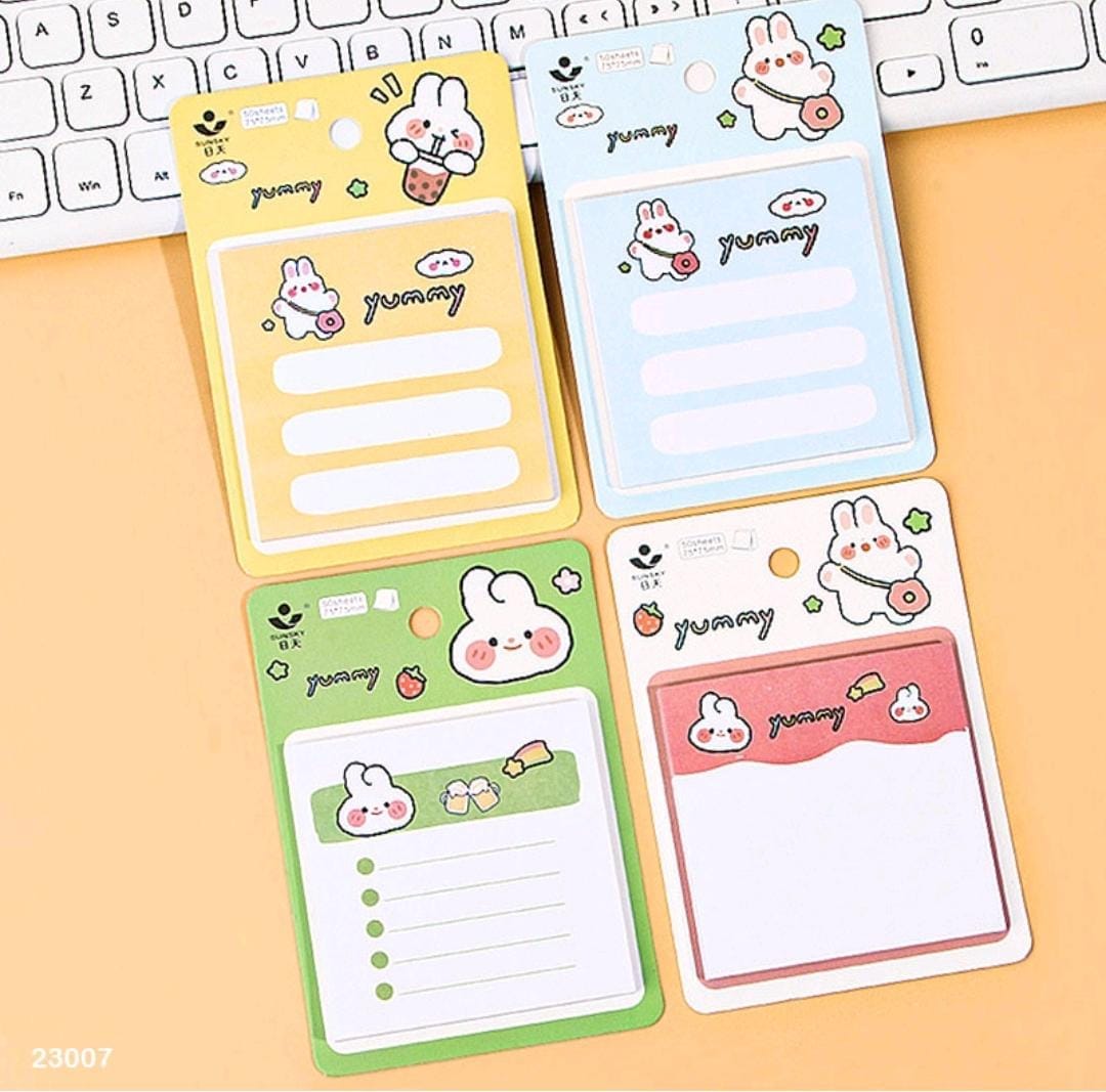 Image of a colorful Kawaii sticky notepad with various designs, showing its compatibility with different pens and durable, ink-resistant paper.