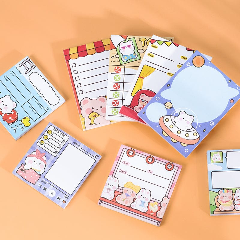 Image of a colorful Kawaii sticky notepad with various designs, showing its compatibility with different pens and durable, ink-resistant paper.